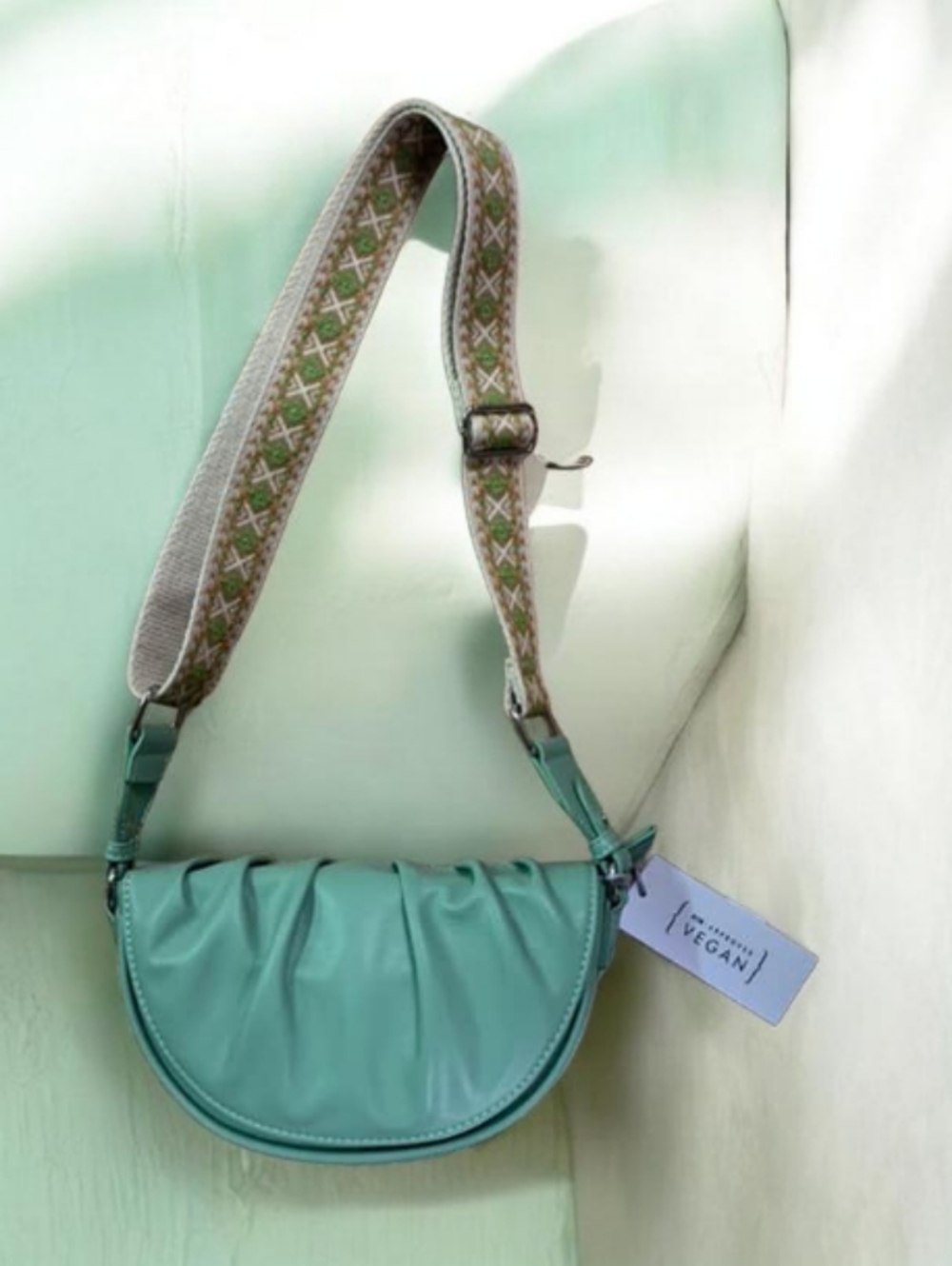 Turquoise Crescent Crossbody Bag with Patterned Strap